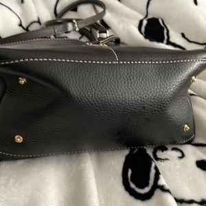 Black leather Dooney and Bourke bag size gold interior hardware and used
